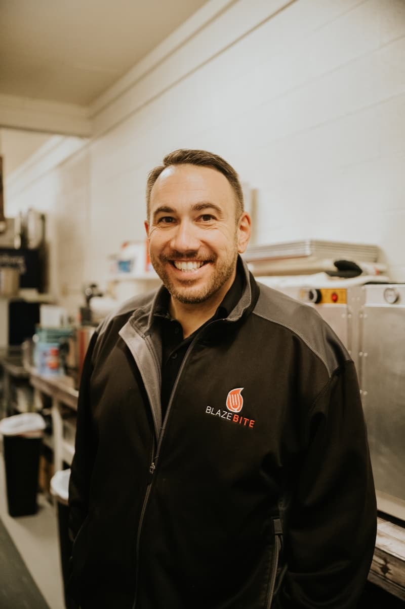 A member of the BlazeBite team at a concession stand