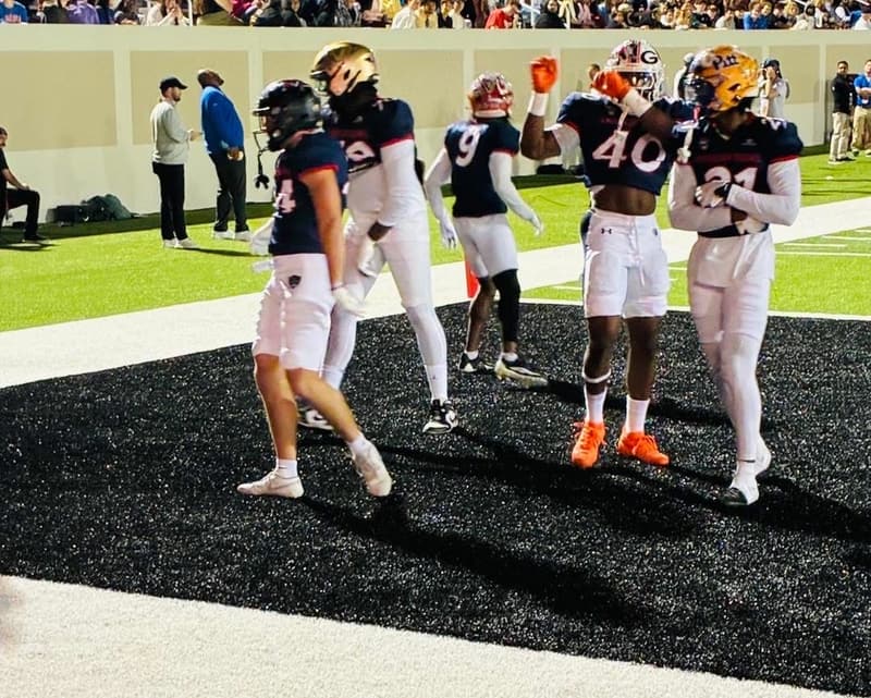 Players on the field during a high school football game