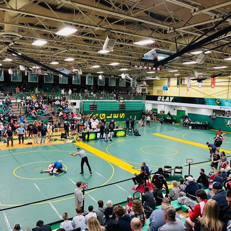 A wrestling meet in a high school gym