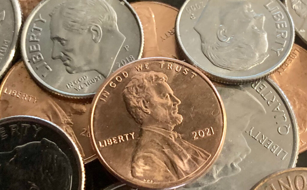 Close-up of various U.S. coins including pennies, nickels, and dimes